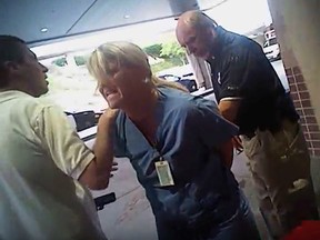 In this frame grab from video taken from a police body camera and provided by attorney Karra Porter, nurse Alex Wubbels is arrested by a Salt Lake City police officer at University Hospital in Salt Lake City.