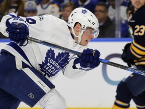 FILE - In this April 3, 2017, file photo, Toronto Maple Leafs forward Auston Matthews (34) gets a shot off during the second period of an NHL hockey game against the Buffalo Sabres in Buffalo, N.Y. Connor McDavid's eight-year, $100 million contract is the latest and most eye-popping example of a shift in priority by NHL teams intent on locking up their young stars. The expectation is for Buffalo's Jack Eichel, Toronto's Auston Matthews and Winnipeg's Patrik Laine to also start cashing in over the next few years. (AP Photo/Jeffrey T. Barnes, File)