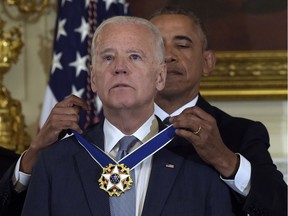 President Barack Obama presents Vice President Joe Biden with the Presidential Medal of Freedom during a ceremony in the State Dining Room of the White House in Washington, Thursday, Jan. 12, 2017. Biden will be in Vancouver, B.C. on Oct. 26 to speak at the Art of Leadership event.