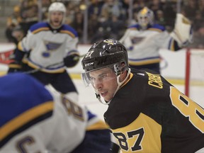 Pittsburgh Penguins' Sidney Crosby (87) chases after St. Louis Blues' Alex Pietrangelo, left, in front of the goal during the first period of the NHL preseason hockey game, Sunday, Sept. 24, 2017, in Cranberry, Pa. The preseason game was awarded to Rostraver Ice Garden, the winner of the 2016-2017 Kraft Hockeyville USA contest, but is being played at the UPMC Lemieux Sports Complex because Rostraver is not suitable for an NHL game. (AP Photo/Keith Srakocic)