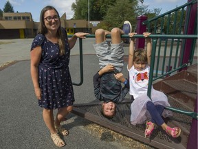 Jen Stewart and her son and daughter play at Simon Fraser Elementary in Vancouver. Stewart is active with the Parent Advisory Network and the organization Families Against Cuts to Education, and hopes new investments in education in B.C. will have long-term benefits for her children.