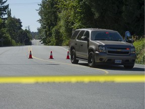 RCMP cordon at 232nd Street in Langley, BC Friday, September 1, 2017 near where two people were murdered earlier in the day.