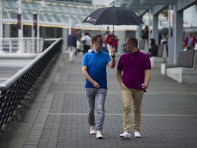 Umbrellas were dusted off as rain and cooler weather returned to the Lower Mainland on Friday.