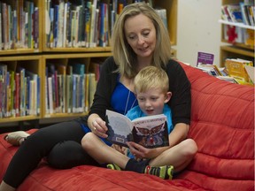 Shelley Hird and her son Hudson, 5, read Artina's West Coast Adventure at a North Vancouver elementary school library.