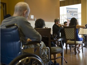 Residents at the Chartwell Carleton Gardens senior home in Burnaby listen to a performance by Borealis String Quartet during a Concerts in Care performance Thursday.
