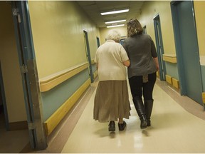 VANCOUVER, BC - MARCH 15, 2017 - Aline Raverty walks with nurse Dione at ASK Friendship Society in Vancouver, B.C., March 15, 2017. Redevelopment is forcing the society to find a new home and may disrupt lives for the seniors who receive help from ASK. (Arlen Redekop / PNG staff photo) (story by Kevin Griffin) [PNG Merlin Archive]
Arlen Redekop, PNG