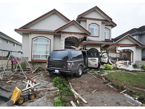 Police on scene at at a house on144 St and 74 Ave after a stretch limousine crashed into it at about 3:00am, in Surrey, BC., September 10, 2017.