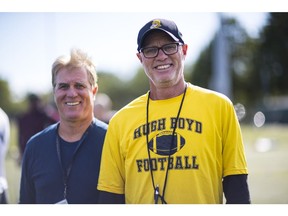 RICHMOND ,Bill (in Yellow) and Bruce (in Blue) Haddow are brothers who coach the Hugh Boyd football team. They're retiring from coaching this year after a combined 84 years of coaching football.,September 13 2017. , Richmond, September 13 2017. Reporter: , ( Francis Georgian / PNG staff photo) ( Prov / Sun News ) 00050571A [PNG Merlin Archive] Francis Georgian, PNG