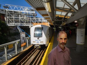 TransLink spokesman Chris Bryan shows off the construction of a new overhead walkway at Commercial-Broadway SkyTrain station in Vancouver.