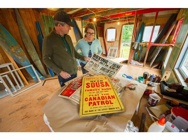 Jeremy and Sus Borsos with posters found underneath the floorboards.