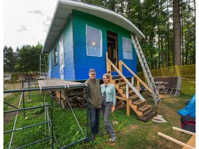 Jeremy and Sus Borsos with the 'Blue Cabin' they're renovating at Maplewood Farm in North Vancouver.