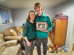 Sabrina and Nathan Drover show some of their their returned possessions, including a framed wedding picture, at their new home in Vancouver on Monday. The Drovers were in the process of moving from New Brunswick when a rented U-Haul truck was stolen Sept. 12 in Abbotsford.