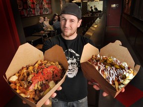Justin Sorichetti shows off two poutine dishes at Smoke's Poutinerie  in  Vancouver  on January  15, 2013.