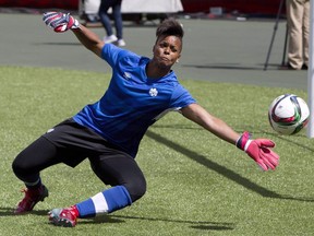 Team Canada's goalkeeper Karina LeBlanc makes a save during a practice session in Edmonton, Alta., on Friday June 5, 2015. LeBlanc, former national team goalkeeper, motivational speaker and media personality, speaks at a UNICEF event at the United Nations General Assembly this week.