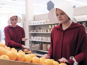 Ofglen (Alexis Bledel) and Offred (Elisabeth Moss), are shown in The Handmaid's Tale.