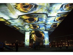 Uninterrupted by Nettie Wild projected underneath the Cambie Bridge. Photo  by Anthony Diehl.