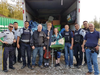 Nathan and Sabrina Drover, centre, are reunited with their stolen belongings.