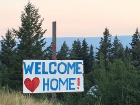 A sign on the side of the highway welcoming people back to Williams Lake, a city in Northern B.C. that was evacuated in July, 2017, due to wildfires.