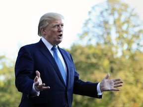 President Donald Trump speaks to reporters upon his return to the White House in Washington, Sunday, Sept. 24, 2017. Citizens of eight countries will face new restrictions on entry to the U.S. under a proclamation signed by Trump on Sunday. (AP Photo/Manuel Balce Ceneta)