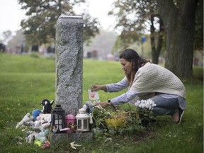 Annick Robinson visits the grave where her son Jacob is buried on Mount Royal Cemetery, in Montreal.