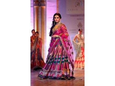 Bollywood actress Huma Qureshi showcases a creation by designer Ashima Leena during the Aamby Valley India Bridal Fashion Week 2013 in Mumbai on late December 2, 2013.
