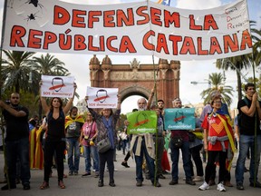 Pro-independence supporters march outside the Parliament of Catalunya.