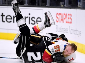 Calgary Flames forward Sam Bennett (right) wrestles Los Angeles Kings forward Nick Shore on Oct. 11.