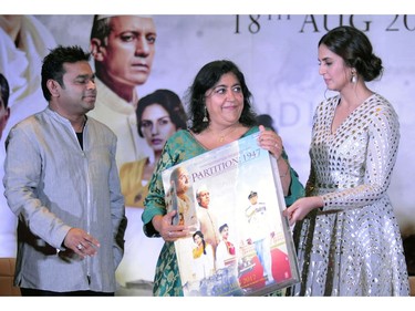 Bollywood actress Huma Qureshi (R) and film score composer and singer AR Rahman (L) take part in a promotional event for the forthcoming Hindi film 'Partition 1947' directed by Gurinder Chadha (C) in Mumbai on July 4, 2017.