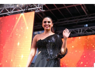 Bollywood actress Huma Qureshi waves at fans during IIFA Stomp in the Times Square on July 13, 2017 to kick off the 18th International Indian Film Academy (IIFA) Festival in New York.