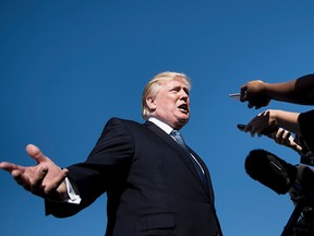 This file photo taken on September 24, 2017 shows US President Donald Trump speaking to the press while boarding Air Force One at Morristown Airport in Morristown, New Jersey.