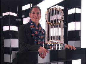 Anita Sehgal, the Houston Astros' senior vice-president of marketing and communications, is shown with the World Series trophy.