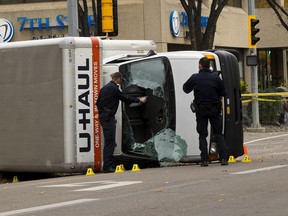 Police investigate a U-Haul truck on 100 Avenue near 106 Street driven by a 30 year old man that was involved in 'acts of terrorism' after an EPS officer was stabbed and pedestrians run down. Taken on Sunday October 1, 2017 in Edmonton. Greg Southam / Postmedia