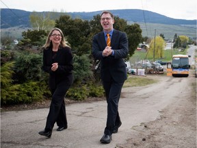 Agriculture Minister Lana Popham, left, with former B.C. NDP Party leader Adrian Dix, has been labelled the "minister of intimidation" by political rivals for her handling of a fish farm controversy.