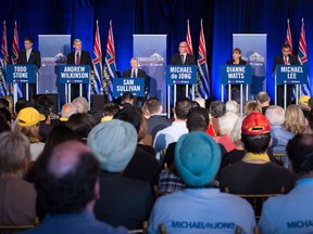 B.C. Liberal leadership candidates Todd Stone, from left, Andrew Wilkinson, Sam Sullivan, Mike de Jong, Dianne Watts and Michael Lee participate in the first leadership debate in Surrey on Oct. 15.