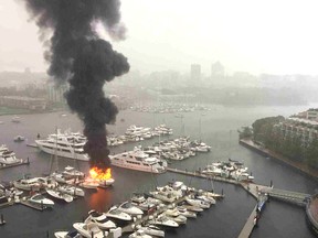 A boat burns in Yaletown Thursday.