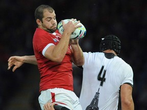 Canada's Brett Beukeboom wins the ball against Romania's Valentin Poparlan in a line out during the Rugby World Cup Pool D match between Canada and Romania at the Leicester City Stadium, Leicester, England, Tuesday, Oct. 6, 2015.