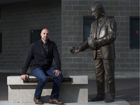 Canucks fan Don Falconer at the Pat Quinn sculpture  outside Rogers Arena, Vancouver, October 05 2017.