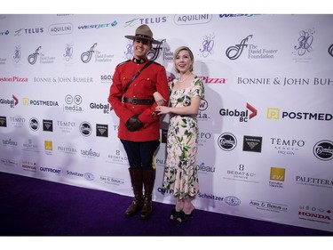 Carly Rae Jepsen

Carly Rae Jepsen poses with a Royal Canadian Mounted Police officer as she arrives for the David Foster Foundation 30th Anniversary Miracle Gala, in Vancouver, B.C., on Saturday October 21, 2017. THE CANADIAN PRESS/Darryl Dyck ORG XMIT: VCRD119
DARRYL DYCK,