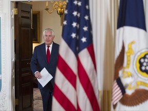Secretary of State Rex Tillerson leaves his office to make a statement to reporters at the State Department in Washington, Wednesday, Oct. 4, 2017. (AP Photo/Cliff Owen)