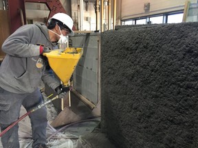 A wall is being plastered with seismic-resistant concrete in this undated handout image. Researchers at the University of British Columbia showed off a new innovation - earthquake resistant concrete - aimed at improving seismic safety.