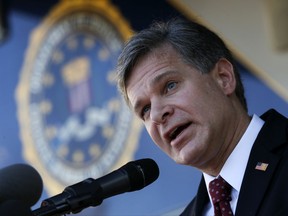 F.B.I director Christopher Wray speaks to reporters after a dedication ceremony for the new Atlanta Field Office building Thursday, Oct. 12, 2017, in Atlanta, (AP Photo/John Bazemore)