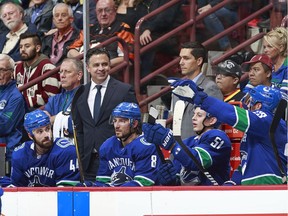 Vancouver Canucks' head coach Travis Green looks down his bench to discuss some in-game strategy with his players. The Canucks, on a four-game winning streak, have a respectable 6-3-1 record.