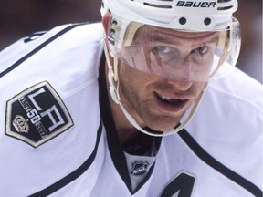 Los Angeles Kings forward Jeff Carter smiles while lining up for a faceoff during first-period NHL action against the Vancouver Canucks at Rogers Arena on March 31, 2017.