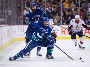 Ottawa Senators goalie Craig Anderson, right, stops Vancouver Canucks' Derek Dorsett during second period NHL hockey action in Vancouver on Tuesday, October 10, 2017.