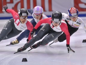 Kim Boutin (left) skates in the 1,500-metre final at a short track speed skating event in Budapest, Hungary, on Sept. 30.