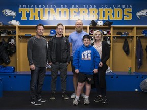 Matt Revel has joined the UBC Thunderbirds out of the WHL. His younger brother Petie, who has Rubinstein–Taybi syndrome and autism, is one of his biggest fans. Father Gord, left, and mother Jen, got a tour of the locker-room along with Petie, from UBC head coach Sven Butenschon.
