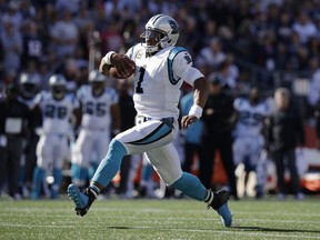 FILE - In this Oct. 1, 2017, file photo, Carolina Panthers quarterback Cam Newton runs during the second half of an NFL football game against the New England Patriots, in Foxborough, Mass. The Panthers were more successful on offense last week with Newton running the football. (AP Photo/Charles Krupa, File)