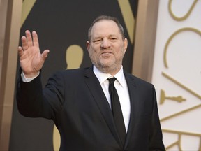 FILE - In this March 2, 2014 file photo, Harvey Weinstein arrives at the Oscars in Los Angeles. Weinstein is taking a leave of absence from his own company after The New York Times released a report alleging decades of sexual harassment against women, including employees and actress Ashley Judd. (Photo by Jordan Strauss/Invision/AP, File)