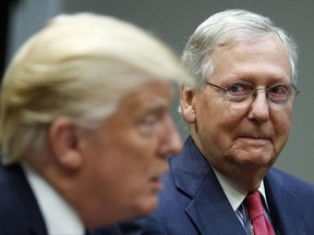 FILE - In this Sept. 5, 2017, file photo, Senate Majority Leader Mitch McConnell, R-Ky., right, listens as President Donald Trump speaks during a meeting with Congressional leaders and administration officials in the Roosevelt Room of the White House in Washington. Trump and McConnell are scheduled to meet Monday, Oct. 16. (AP Photo/Evan Vucci, File)