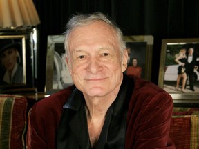 In this April 7, 2006 file photo, Playboy founder Hugh Hefner is photographed at the Playboy Mansion in the Holmby Hills area of Los Angeles. Hefner has died at age 91. The magazine released a statement saying Hefner died at his home of natural causes Wednesday night, Sept. 27, 2017, surrounded by family.